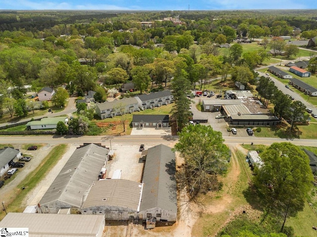 bird's eye view featuring a wooded view