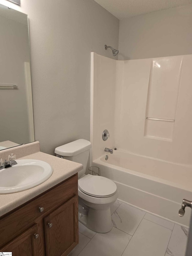 bathroom featuring toilet, vanity, shower / tub combination, and a textured ceiling