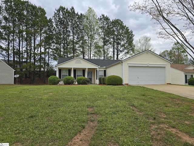 view of front of house with a garage, concrete driveway, and a front yard