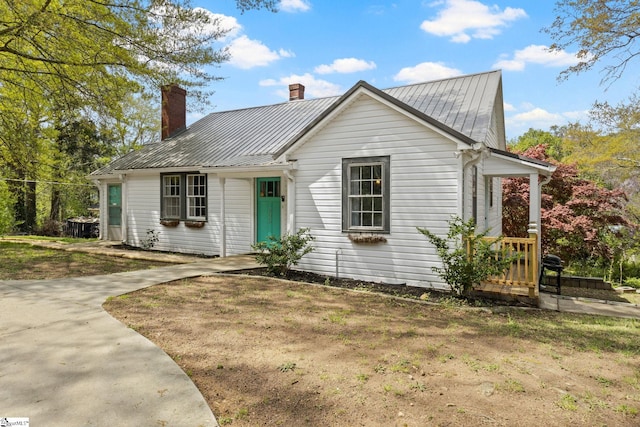 305 Morse St, Pendleton, SC 29670 - view of front of house with metal roof, a chimney, and a standing seam roof