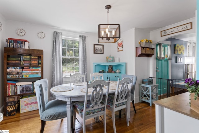 305 Morse St, Pendleton, SC 29670 - dining room with arched walkways, ornamental molding, wood finished floors, and an inviting chandelier