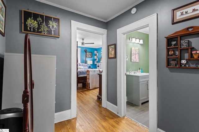 305 Morse St, Pendleton, SC 29670 - hallway featuring baseboards, a sink, light wood-style floors, and crown molding