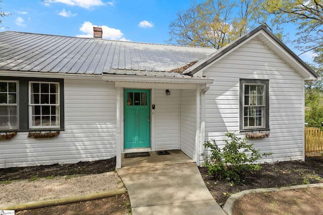 305 Morse St, Pendleton, SC 29670 - property entrance with a chimney, fence, and metal roof