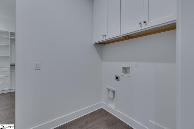 clothes washing area with baseboards, washer hookup, dark wood finished floors, hookup for an electric dryer, and cabinet space