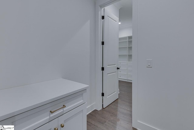 corridor featuring light wood finished floors