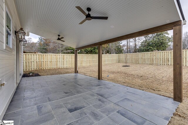 view of patio / terrace with a fenced backyard and a ceiling fan