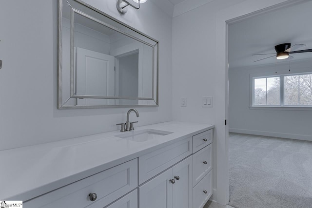 bathroom with vanity, baseboards, and a ceiling fan