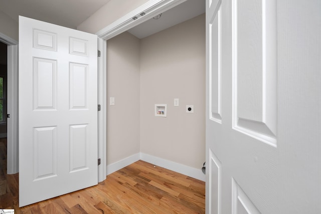 laundry room with baseboards, laundry area, hookup for an electric dryer, light wood finished floors, and hookup for a washing machine