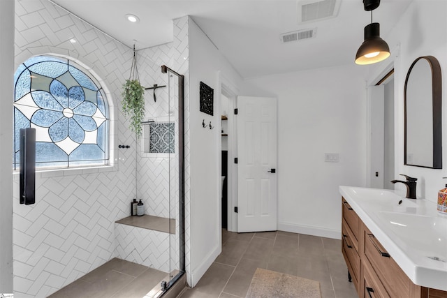 full bathroom featuring a shower stall, tile patterned flooring, and visible vents