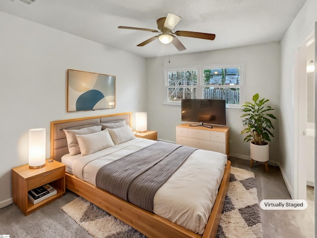 bedroom featuring baseboards and a ceiling fan