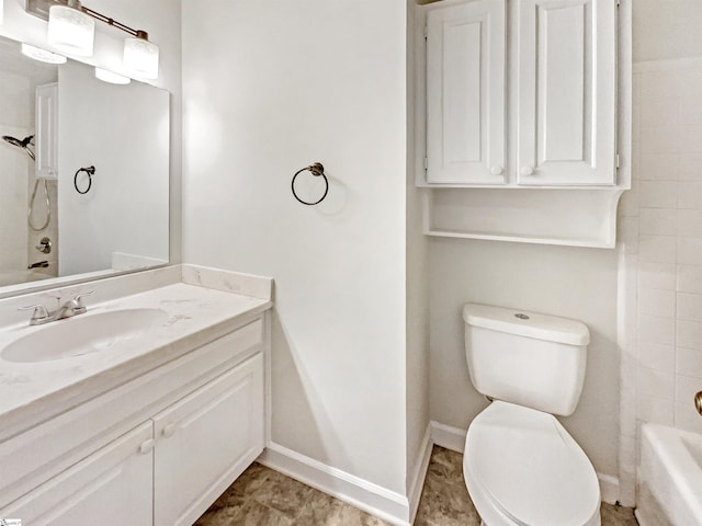 bathroom featuring vanity,  shower combination, baseboards, and toilet