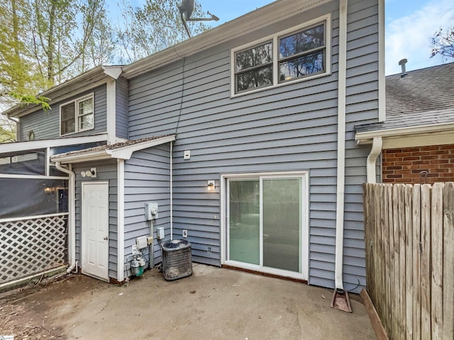 back of house featuring a patio, fence, and central AC unit