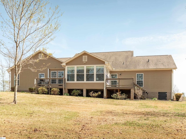 back of house with roof with shingles, a wooden deck, a lawn, and stairs