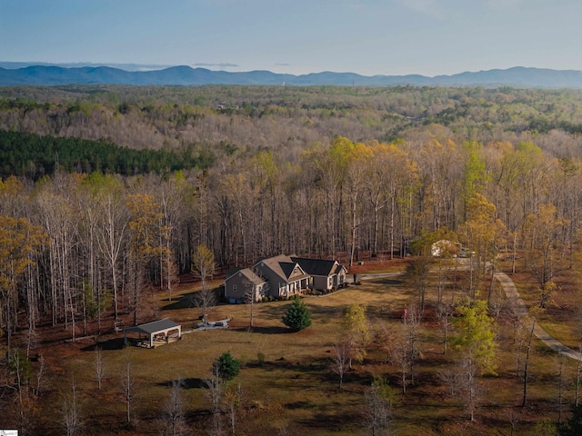 aerial view with a mountain view and a view of trees