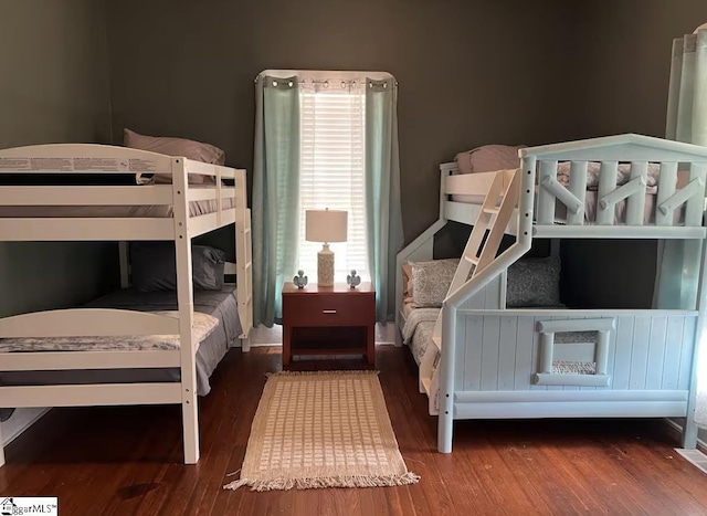 bedroom with wood finished floors