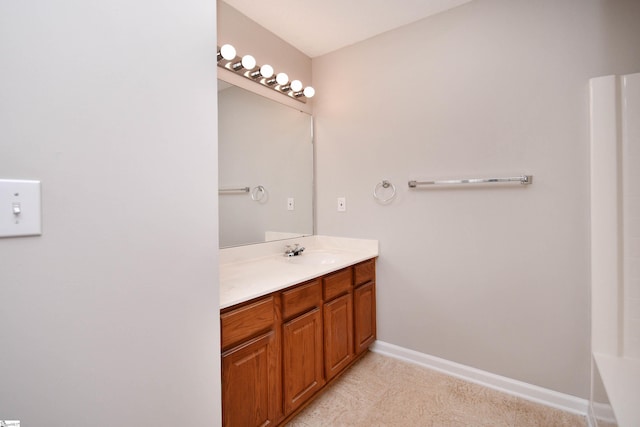bathroom featuring vanity and baseboards