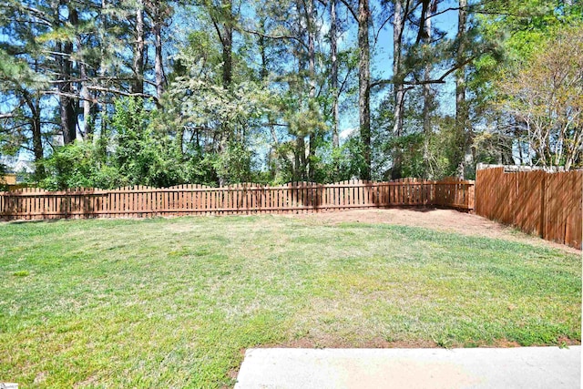 view of yard with a fenced backyard