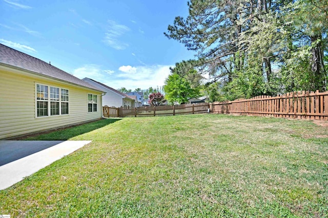 view of yard with a fenced backyard
