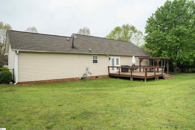 back of house featuring roof with shingles, a pergola, crawl space, a wooden deck, and a yard