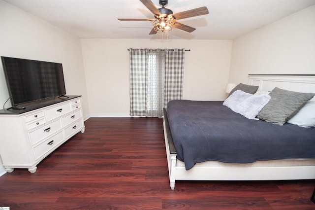 bedroom featuring wood finished floors, baseboards, and a ceiling fan