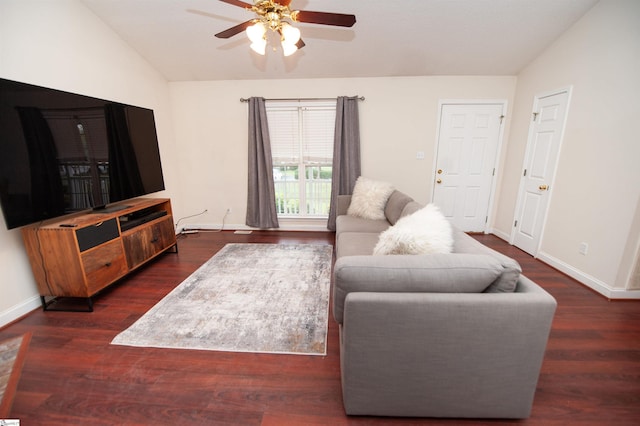 living area with wood finished floors, baseboards, a ceiling fan, and lofted ceiling