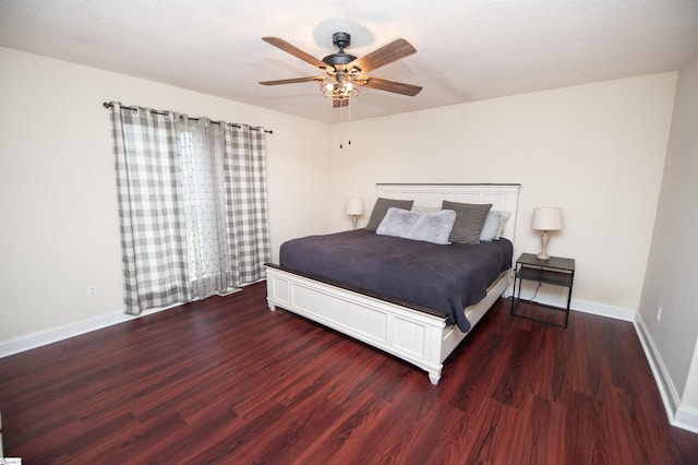 bedroom with a textured ceiling, wood finished floors, ceiling fan, and baseboards