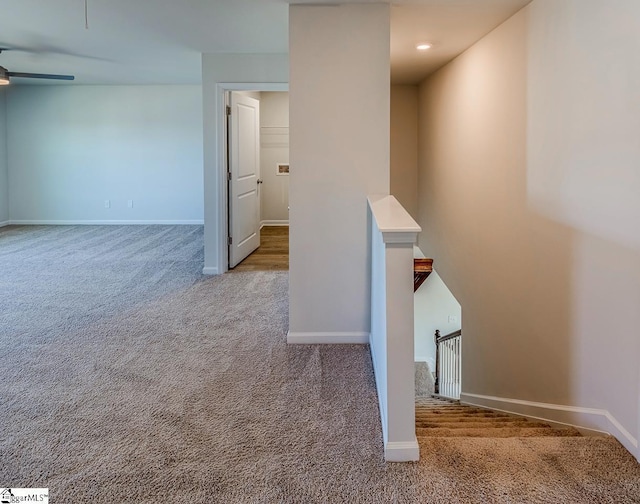 interior space featuring baseboards, a ceiling fan, carpet, and recessed lighting