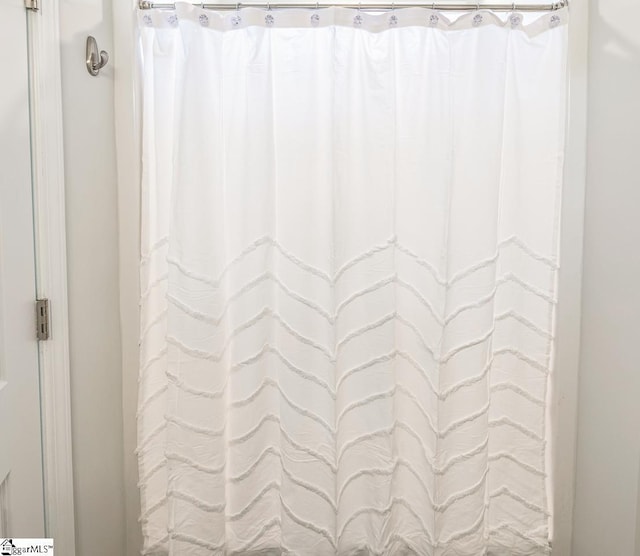 bathroom with curtained shower