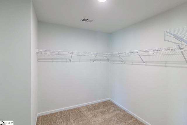 walk in closet with carpet flooring and visible vents