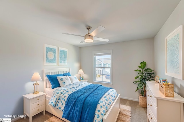 bedroom with light carpet, baseboards, and a ceiling fan
