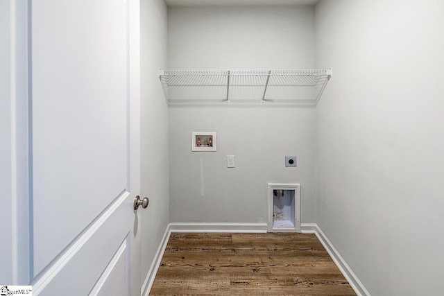washroom featuring hookup for an electric dryer, baseboards, washer hookup, laundry area, and wood finished floors
