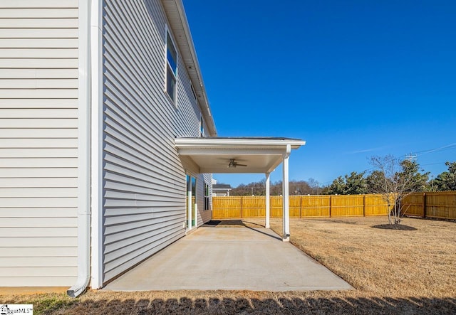 view of yard with a ceiling fan, a patio, and fence