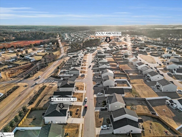 birds eye view of property with a residential view