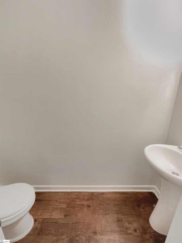 106 Elmhaven Dr, Simpsonville, SC 29681 - half bathroom featuring toilet, wood finished floors, and baseboards