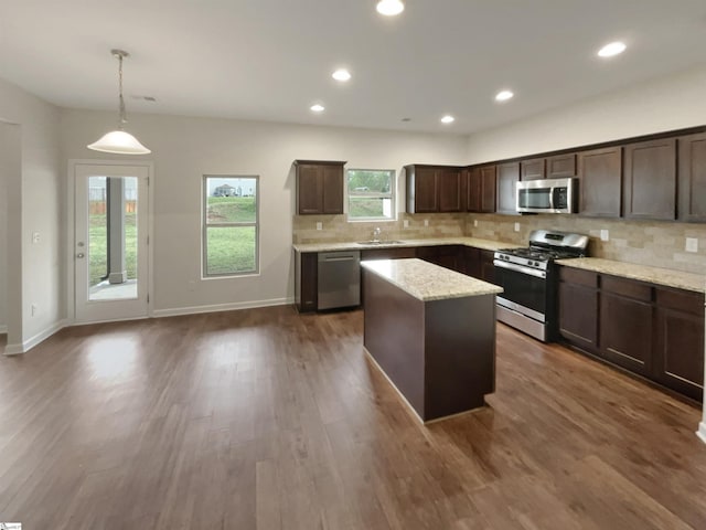 106 Elmhaven Dr, Simpsonville, SC 29681 - kitchen with stainless steel appliances, dark wood-type flooring, dark brown cabinetry, and a kitchen island