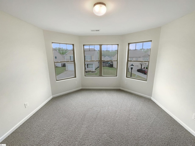106 Elmhaven Dr, Simpsonville, SC 29681 - carpeted empty room featuring plenty of natural light, visible vents, and baseboards
