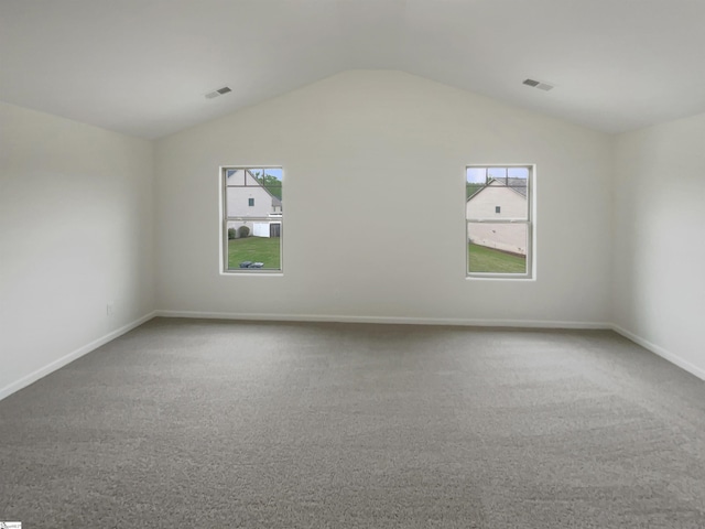 106 Elmhaven Dr, Simpsonville, SC 29681 - carpeted empty room featuring baseboards, lofted ceiling, visible vents, and plenty of natural light