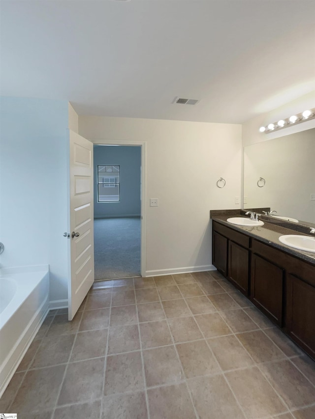 106 Elmhaven Dr, Simpsonville, SC 29681 - bathroom featuring a sink, visible vents, a bath, and baseboards
