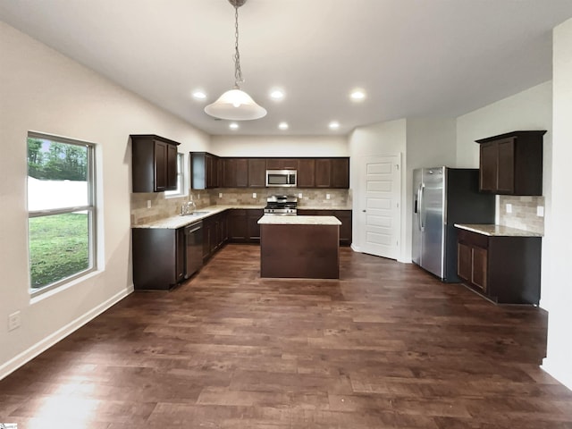 106 Elmhaven Dr, Simpsonville, SC 29681 - kitchen with a kitchen island, dark brown cabinetry, a sink, and appliances with stainless steel finishes