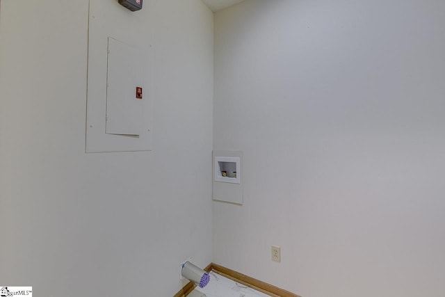 washroom featuring electric panel, laundry area, baseboards, and hookup for a washing machine