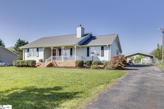 view of front of house featuring covered porch, a front lawn, a chimney, a shingled roof, and driveway