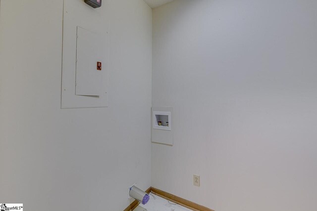 laundry area featuring laundry area, baseboards, hookup for a washing machine, and electric panel