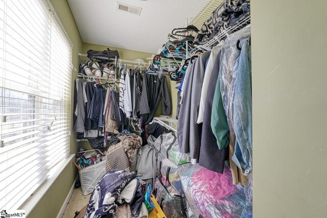 walk in closet featuring visible vents