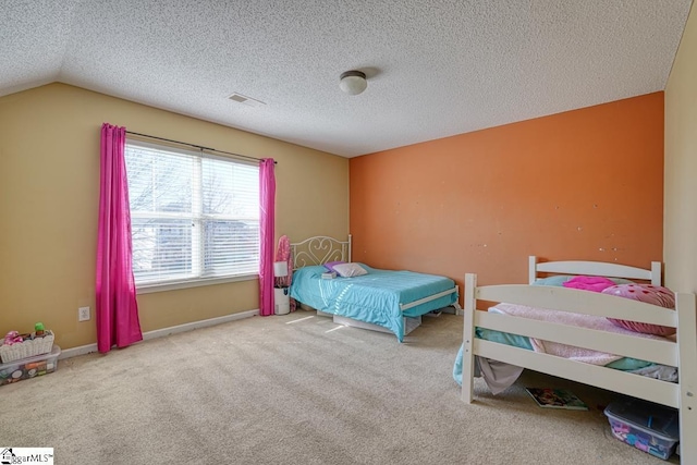 carpeted bedroom with visible vents, baseboards, lofted ceiling, and a textured ceiling