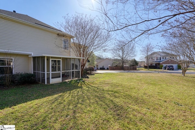 view of yard featuring a sunroom