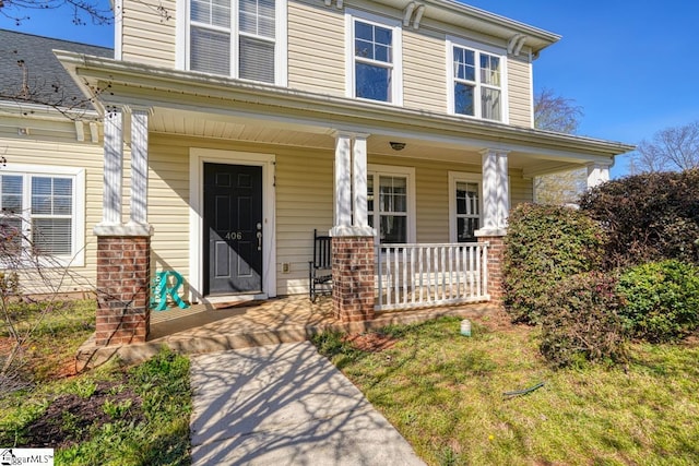 entrance to property with covered porch