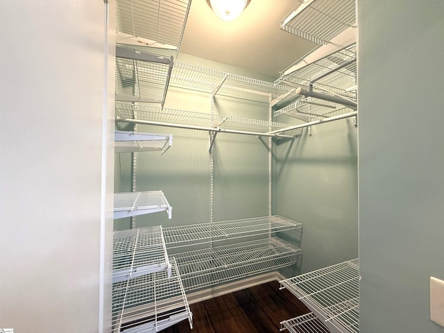 spacious closet with wood finished floors