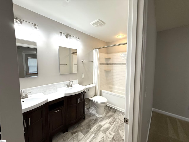 bathroom featuring double vanity, visible vents, toilet, a sink, and shower / bath combo with shower curtain