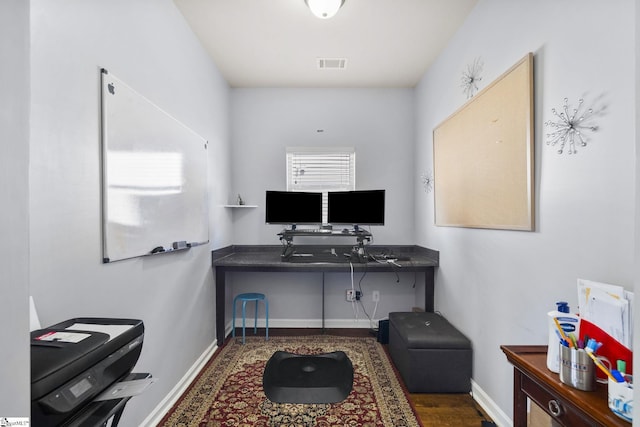 office with visible vents and baseboards