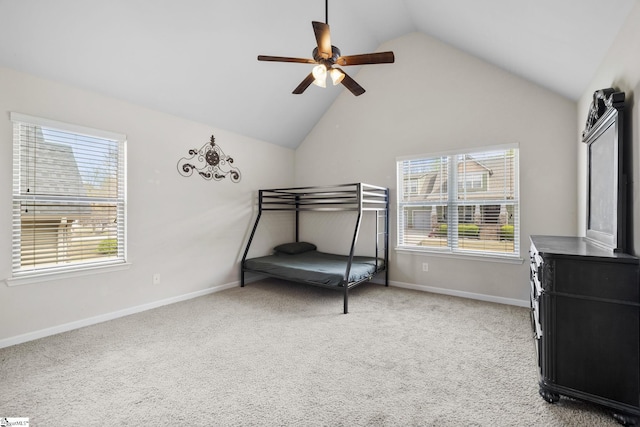 bedroom featuring light carpet, baseboards, a ceiling fan, and vaulted ceiling